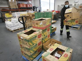 WINDSOR, ONTARIO. OCTOBER 29, 2021 - Mohamed Chreif, a volunteer at the Unemployed Help Centre of Windsor is shown in the food bank area of the organization on Friday, October 29, 2021.