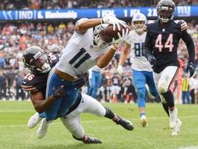 Detroit Lions wide receiver Kalif Raymond scores a touchdown in the second half against Chicago Bears defensive back Deon Bush at Soldier Field.