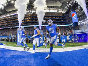 Detroit Lions defensive end Romeo Okwara (95) runs onto the field before the start of an NFL game against the San Francisco 49ers at Ford Field.