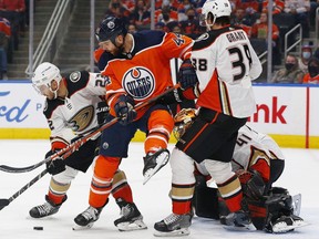 Edmonton Oilers forward Zack Kassian battles for a loose puck with Anaheim Ducks forward Derek Grant and defensemen Kevin Shattenkirk during the first period at Rogers Place.