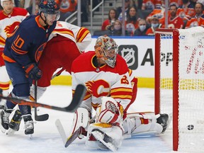 Edmonton Oilers forward Derek Ryan scores a first period goal against Calgary Flames goaltender Jacob Markstrom at Rogers Place.