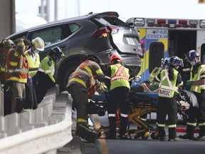 Emergency personnel are shown at the scene of a single vehicle accident on Sunday, October 3, 2021 on Huron Church Road at the EC Row Expressway. The vehicle reportedly left the highway, broke trough a guard rail on an overpass and ended up on Huron Church.