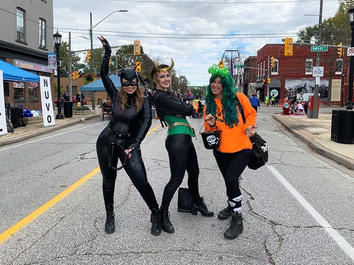 Kerri Kavanaugh, Sydney Kelly, and Maciejka Gorzelnik show off their costumes at the west end activity hub of Open Streets Windsor 2021. Photographed Oct. 17, 2021.