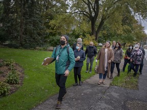 Walter Petrichyn, from Museum Windsor, leads the Riverside History Walking Tour on Riverside Drive East, on  Oct. 30, 2021.