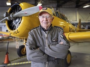 Lt. Colonel Ron Holden, a retired RCAF pilot turned 90 on Wednesday. He is a lifelong member, volunteer and active pilot for the Canadian Aviation Museum. He is shown in front of a Harvard at the museum on Thursday, October 28, 2021.