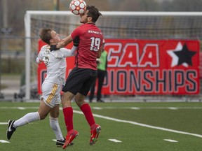 St. Clair's Matteo Mejalli, left, battles Seneca's Aaron Toniolo during the bronze medal game of the OCAA men's soccer championships at Acumen Stadium on Saturday.