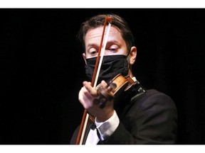 Konstantin Popovic, a violinist with the Windsor Symphony Orchestra, performs at a press conference on Tuesday announcing major improvements to the 121-year-old arts centre.