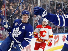 Auston Matthews #34 of the Toronto Maple Leafs scores he game winning goal at 2:32 of overtime against the Calgary Flames at the Scotiabank Arena on November 12, 2021 in Toronto.