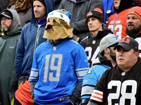 A fan of the Detroit Lions wears a paper bag over his head during the game between the Detroit Lions and the Cleveland Browns at FirstEnergy Stadium on November 21, 2021 in Cleveland, Ohio.