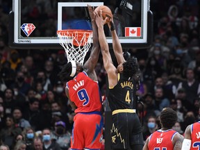 Detroit Pistons forward Jerami Grant (9) blocks a dunk attempt from Toronto Raptors forward Scottie Barnes (4) in the first half at Scotiabank Arena.