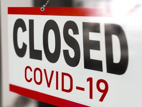 Closed due to COVID sign.