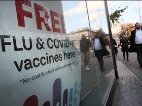 A sign at a drug store advertises the COVID-19 vaccine on Nov. 19, 2021 in New York City.
