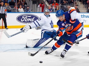 Maple Leafs goaltender Joseph Woll blocks the net against Oliver Wahlstrom of the New York Islanders during the second period at the UBS Arena on Sunday, Nov. 21, 2021 in Elmont, N.Y.