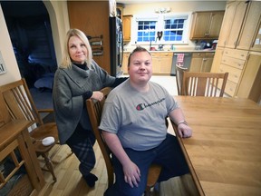 Dawn Bezaire is shown with her son Jeremy Bezaire, 22, at their home in Harrow on Thursday, November 11, 2021. Jeremy, who works full-time, would like to move out of his parents' home but is having difficulty finding affordable housing.