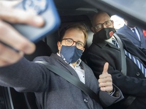 Christoph Lienemann, left, director of Canadian Automobility Enterprises, poses for a selfie with Mayor Drew Dilkens before taking a drive in the company's zero emissions electric delivery vehicle at a press conference at St. Clair College, on Wednesday, Nov. 24, 2021.
