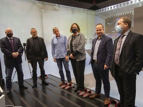 Key players involved in Wednesday's automobility announcement are pictured inside the Invest Windsor Essex VR Cave, on Monday, Nov. 22, 2021.