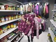 Tracey Bailey, CEO of the Community Support Centre of Essex County poses with donated coats at the organization on Wednesday, November 3, 2021.