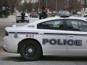 Windsor officers are shown on Dougall Avenue between Chatham and University on Thursday, November 18, 2021 where an investigation was taking place.