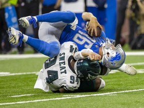 Detroit Lions quarterback Jared Goff  is sacked by Philadelphia Eagles defensive end Josh Sweat in the second quarter at Ford Field.