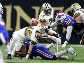 New Orleans Saints quarterback Trevor Siemian is sacked by Buffalo Bills defensive tackle Ed Oliver in the second quarter at the Caesars Superdome.