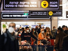 Travellers exit the coronavirus disease (COVID-19) pandemic testing area at Ben Gurion International Airport as Israel imposes new restrictions near Tel Aviv, Israel November 28, 2021.