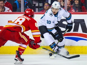 San Jose Sharks right wing Nick Merkley (10) controls the puck against the Calgary Flames during the third period at Scotiabank Saddledome in Calgary, Nov. 9, 2021.