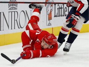 Detroit Red Wings centre Dylan Larkin (71) goes after the puck db Washington Capitals defenceman Martin Fehervary (42) in the second period at Little Caesars Arena in Detroit on Nov. 11, 2021.