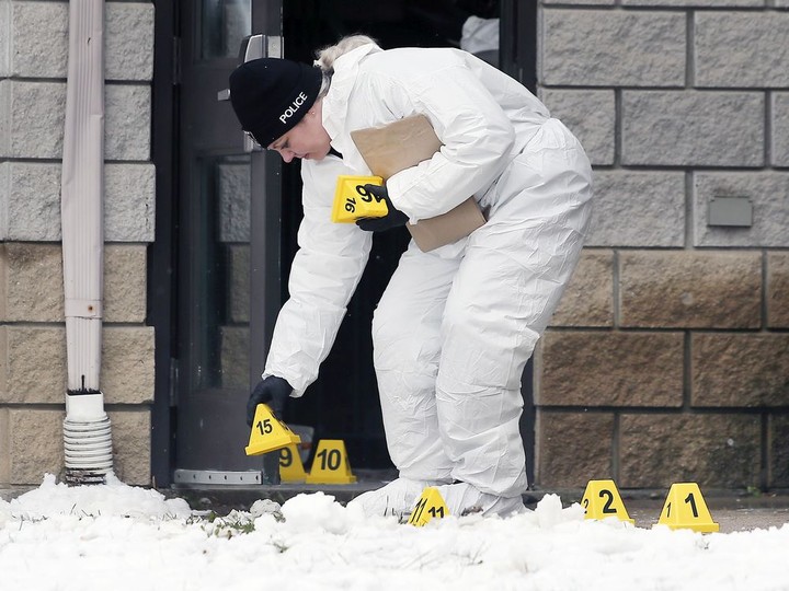  A Windsor Police forensic officer is shown at the Lexington Inn & Suites hotel in Windsor on Sunday, November 28, 2021.
