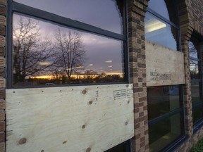 Boarded up windows at the Windsor Public Library - Forest Glade branch, are seen on Tuesday, Nov. 16, 2021.