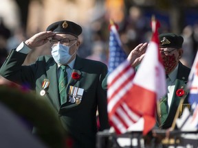 Honouring comrades. Robert Goyeau, 87, a veteran of peacekeeping in Korea, salutes at the foot of the cenotaph during the laying of wreaths at the  Remembrance Day ceremony in downtown Windsor on Thursday, Nov. 11, 2021.