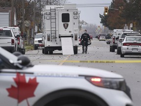 A Windsor officer is shown in the 1700 block of Drouillard Road on Wednesday, November 17, 2021 where a man was arrested in connection with a bomb incident at the Windsor Assembly Plant recently.