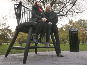The City of Windsor unveiled the "You and Me Chairs" at the Jackson Park on Tuesday, November 2, 2021. The sculpture is the latest installation in Windsor's public art collection. Local artists Laura and Mark Williams who created the chairs pose for a photo during the press conference.