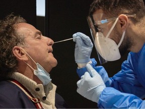 The passenger of a flight from South Africa is tested for the Coronavirus at Amsterdam Schiphol airport on December 2, 2021 in Amsterdam, Netherlands.