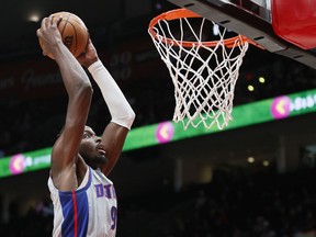 Jerami Grant of the Detroit Pistons dunks against the Portland Trail Blazers during the third quarter at Moda Center on November 30, 2021 in Portland, Oregon.