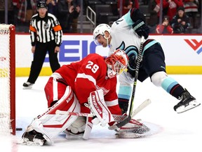 Joonas Donskoi of the Seattle Kraken scores a shootout goal past Thomas Greiss of the Detroit Red Wings at Little Caesars Arena on December 01, 2021 in Detroit, Michigan. Detroit won the game 4-3 in a shootout.