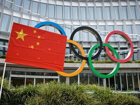 A Chinese flag flutters in front of the IOC headquarters during a protest by activists of the International Tibet Network against the Beijing 2022 Winter Olympics on Feb. 3, 2021 in Lausanne, Switzerland.