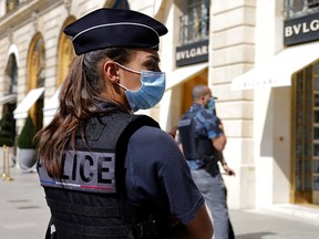 French police stand in front of the Bulgari jewellery store following a robbery at Place Vendome in Paris, France, September 7, 2021.