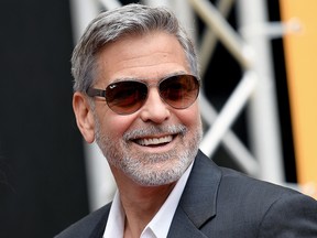 In this file photo taken on May 13, 2019 George Clooney poses during a photocall of the Catch-22 TV show in Rome.