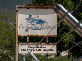 In this file photo taken Oct. 22, 2021, a sign stands outside the Christian Aid Ministries in Titanyen, Haiti.