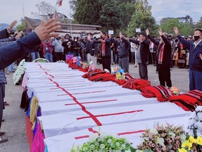 People attend a mass funeral of civilians who were mistakenly killed by security forces, in Mon district of the northeastern state of Nagaland, India, December 6, 2021.