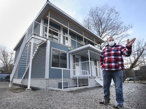 Matt Lubberts, president of NOW Housing is shown on Monday, December 6, 2021 in front of the multi-unit housing complex his company built out of shipping containers. The residence is located in the 200 block of Watkins Street in the city's west end.