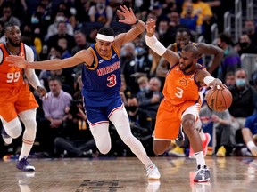 Phoenix Suns guard Chris Paul steals the ball from Golden State Warriors guard Jordan Poole in the third quarter at the Chase Center.