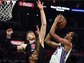 Sacramento Kings forward Louis King shoots the ball while defended by Los Angeles Clippers center Isaiah Hartenstein (left) during the fourth quarter at Staples Center.
