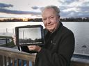 Ron Renaud of Amherstburg shows a picture of the tower on Boblo Island - within sight of where the tower used to be located before its demolition. Photographed Dec. 2, 2021.