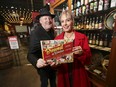 Chris Edwards and Elaine Weeks display their latest book "Brewed in Windsor" at the Walkerville Brewery on Monday, December 6, 2021.