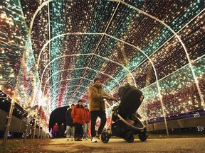 People enjoy the sights at the Bright Lights Windsor display at the Jackson Park on Thursday, December 2, 2021.