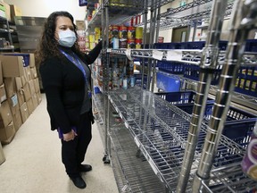 Rukshini Ponniah-Goulin, interim executive director of the Downtown Mission is shown at the organization's food bank on Tuesday, December 7, 2021. There is a shortage of donations and volunteers.