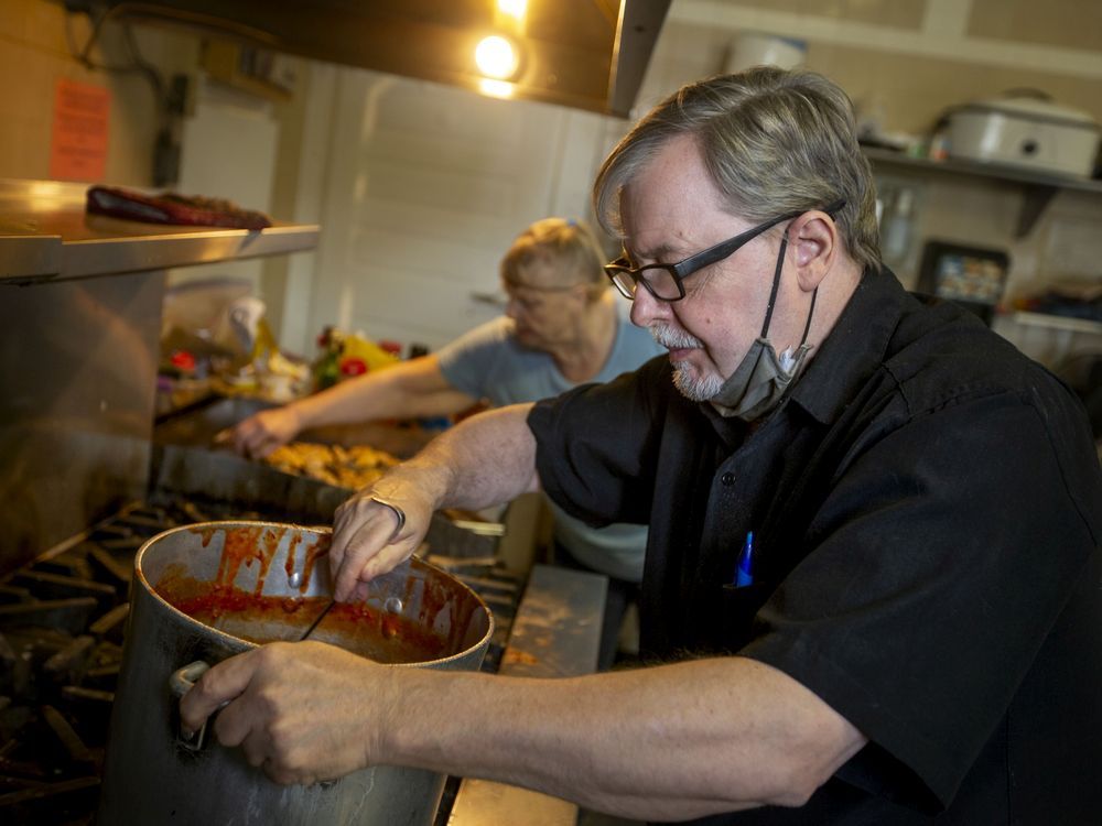  Roger Fordham prepares food at New Song Church, on Thursday, Dec. 2, 2021. According to Feed Ontario, demand for food banks has reached record levels across Ontario.