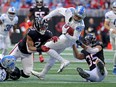 Detroit Lions wide receiver KhaDarel Hodge fights for yards against Atlanta Falcons linebacker Mykal Walker and cornerback Avery Williams on a fourth down conversion during the first half at Mercedes-Benz Stadium.