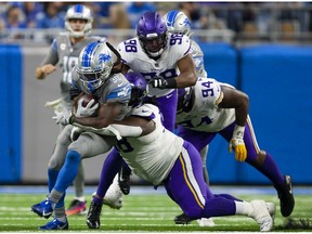 Detroit Lions running back Jamaal Williams runs the ball during the fourth quarter against the Minnesota Vikings at Ford Field.